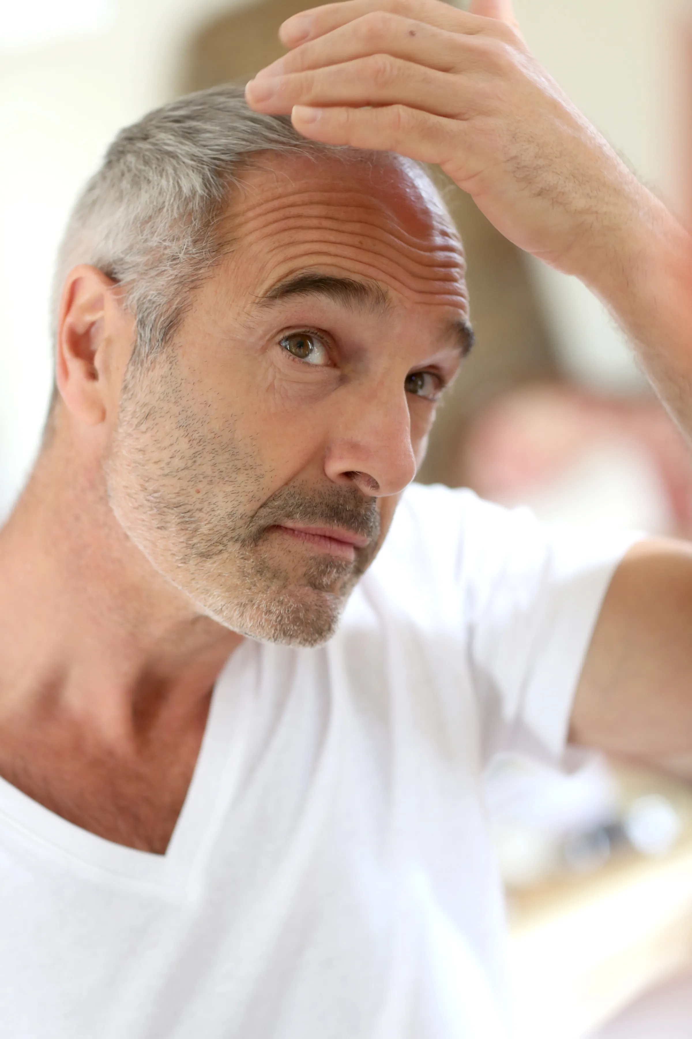 Confident man with healthy hair outdoors