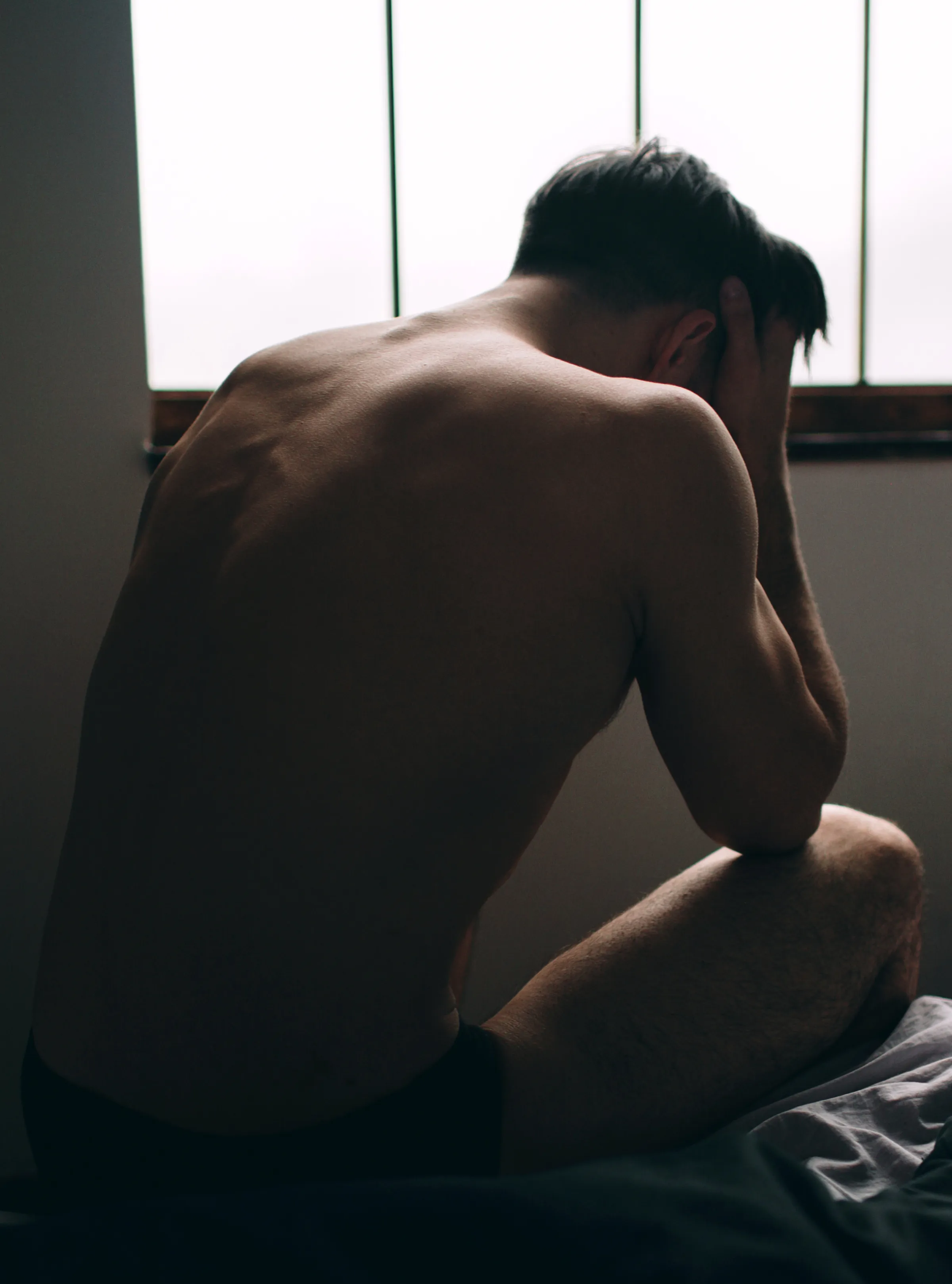 Man at ease in a sunlit room